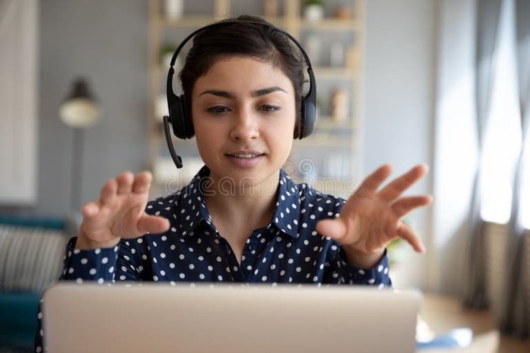 
Online tutor teaching students on a laptop screen, surrounded by books, charts, and digital learning icons, expressing side hustles that work well in a tough economy .
